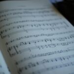 Detailed close-up of an open music book showing sheet music notes.